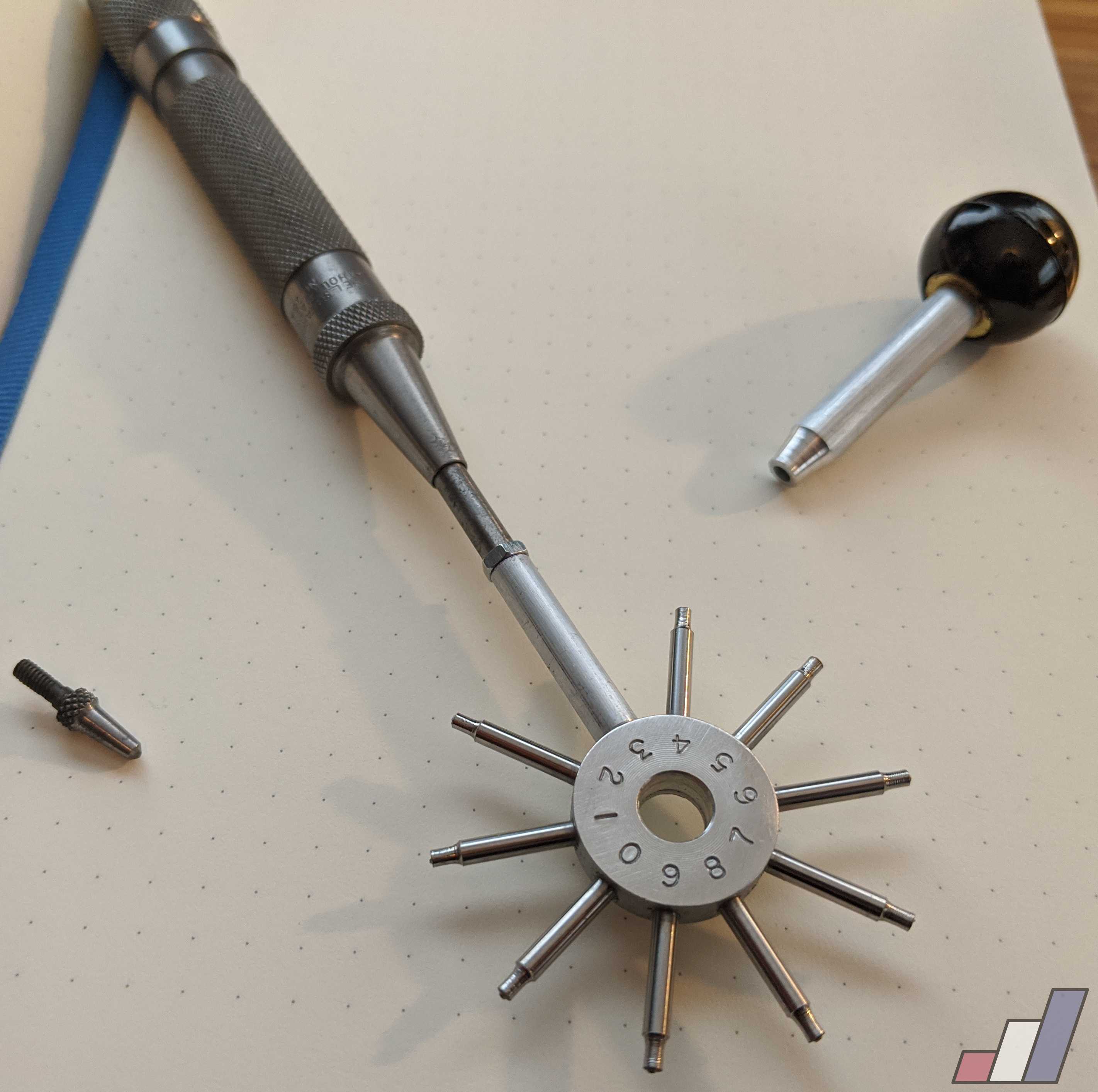 Microstamping tool with a shop-built adapter for an automatic punch.