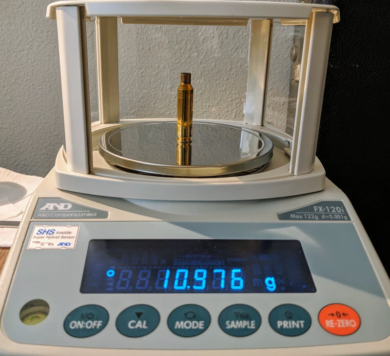 Weighing a clean, empty brass case.