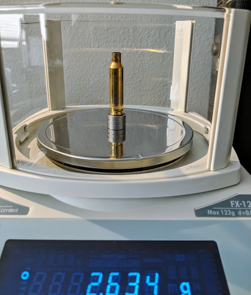 Measuring case volume with 99.9% isopropyl alcohol, an A&D scale, and primer pocket plugs.