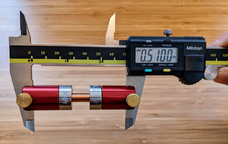 Measuring the bullet’s bearing surface with calipers and a set of comparators.