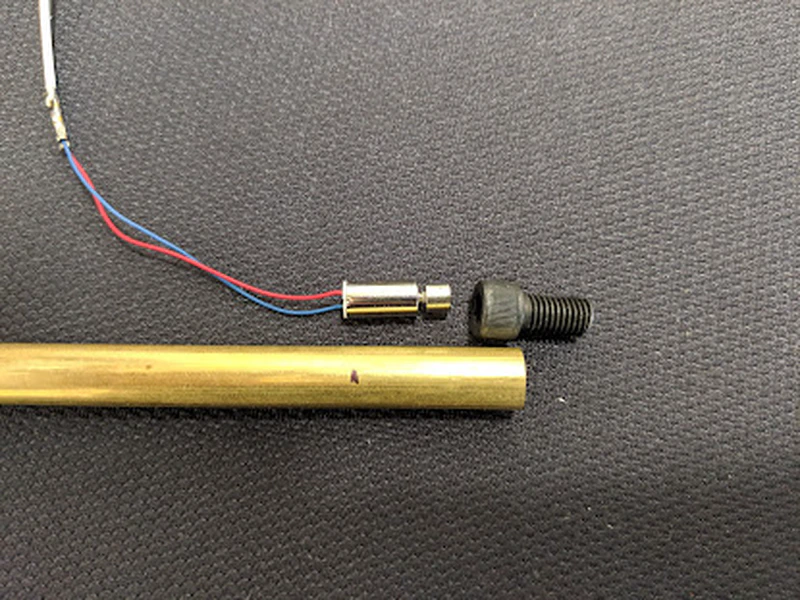 Cut a small piece of brass tube to attach the motor to the back of the trickler tube.