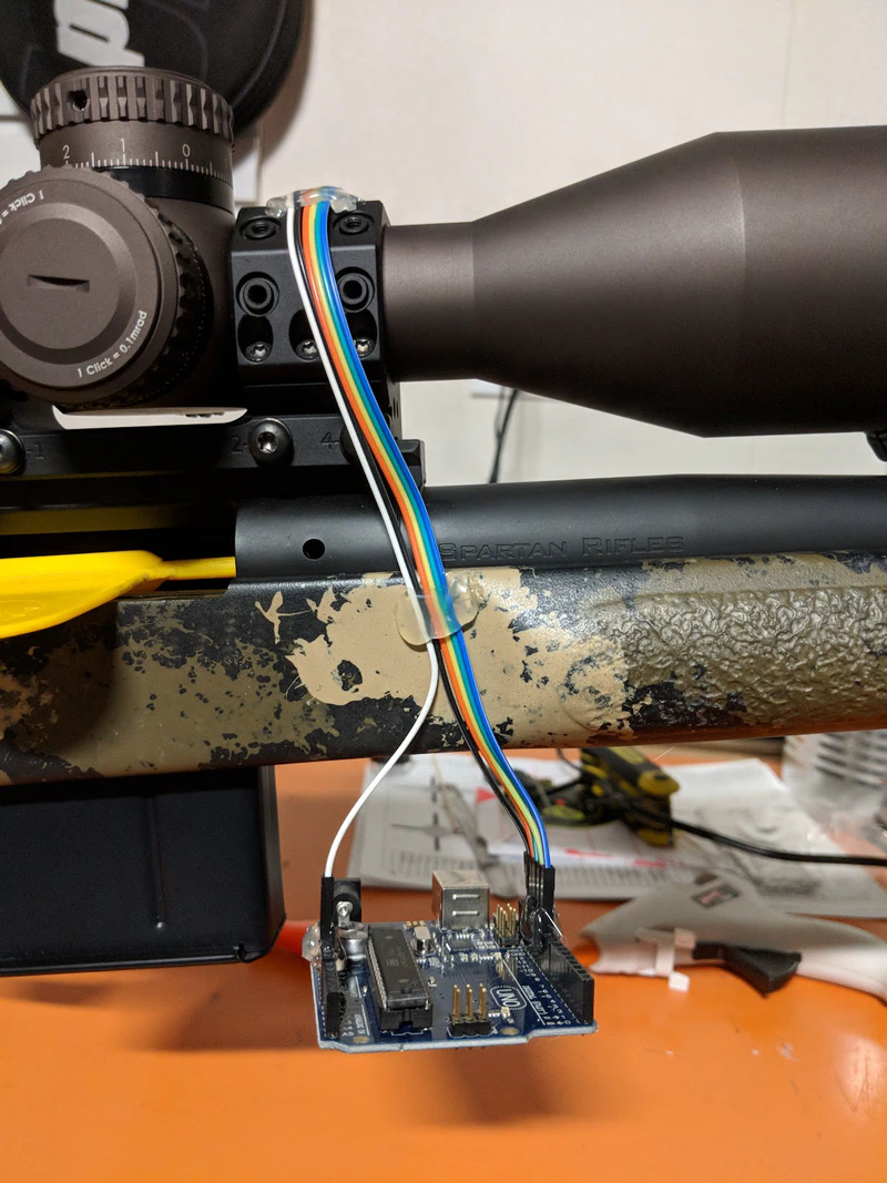 On the first prototype, an Arduino Uno was left dangling from the rifle.